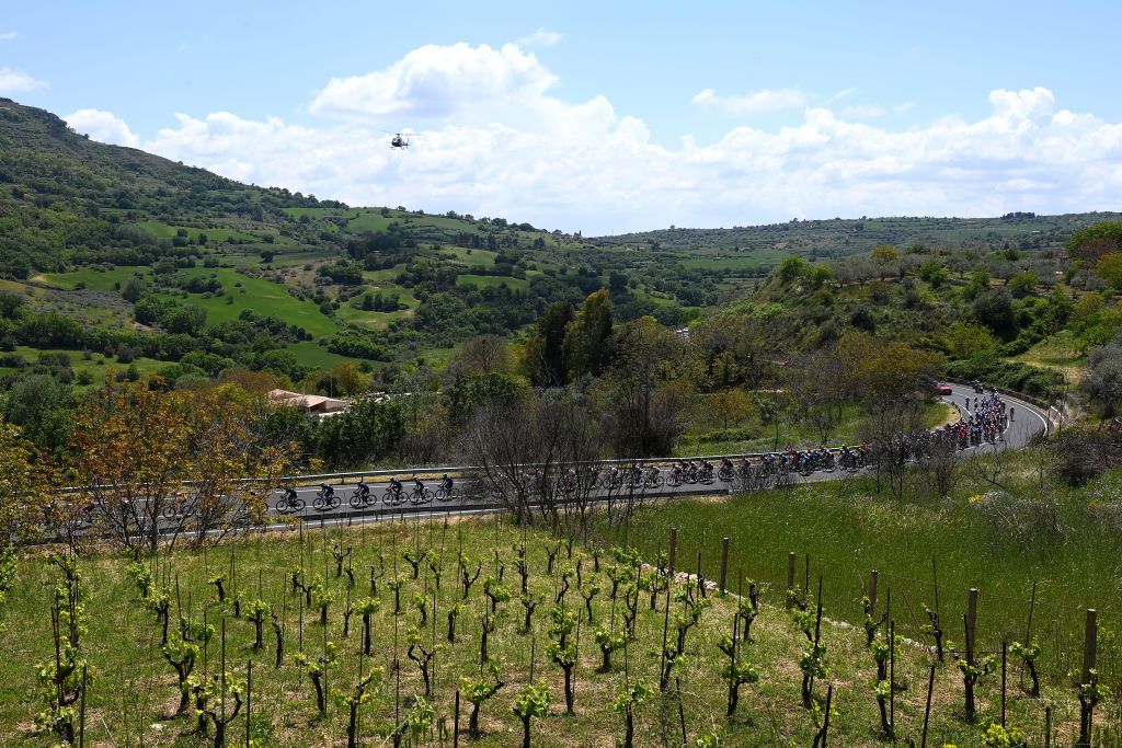 ETNA PIAZZALE RIFUGIO SAPIENZA ITALY MAY 10 A general view of the peloton passing through Svinc di Buccheri 785m during the 105th Giro dItalia 2022 Stage 4 a 172km stage from Avola to Etna Piazzale Rifugio Sapienza 1899m Giro WorldTour on May 10 2022 in Etna Piazzale Rifugio Sapienza Italy Photo by Tim de WaeleGetty Images