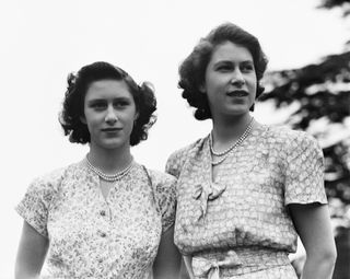 Princess Elizabeth and her sister Princess Margaret (1930 - 2002) at the Royal Lodge, Windsor, UK, 8th July 1946.