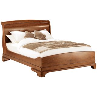 Wooden Willis and Gambier Lille sleigh king-sized bed with neutral bedlinen