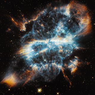 The planetary nebula NGC 5189, imaged by the Hubble Space Telescope. A planetary nebula is actually a star that uses up the last of its fuel, and then expels a large portion of its outer material into space.