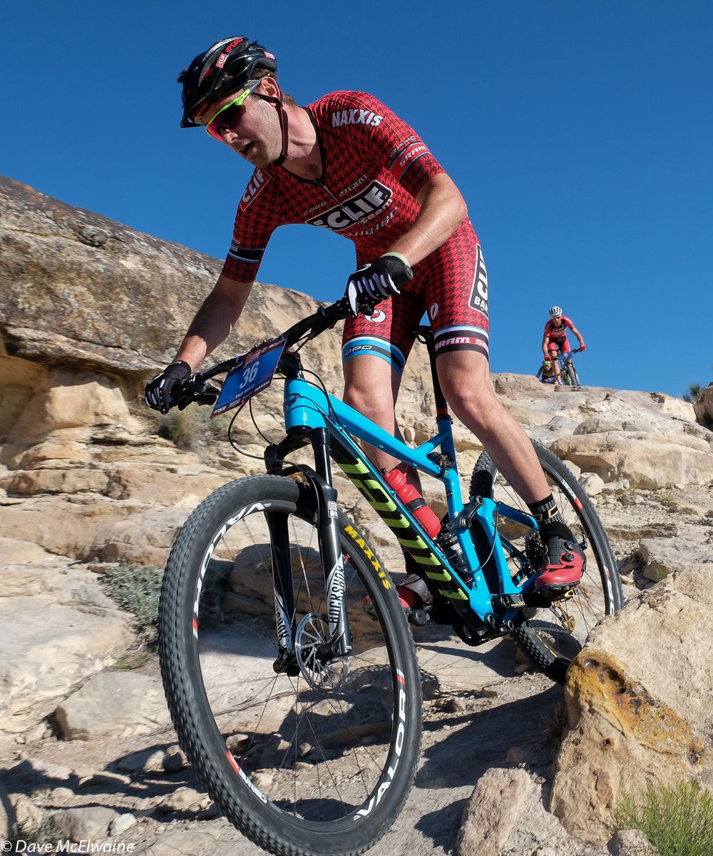 Troy Wells (Clif Bar) descending slickrock with his brother Todd behind him
