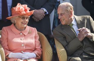 Queen Elizabeth II and Prince Philip, Duke of Edinburgh attend Royal Windsor Cup 2018 polo match at Guards Polo Club on June 24, 2018 in Egham, England