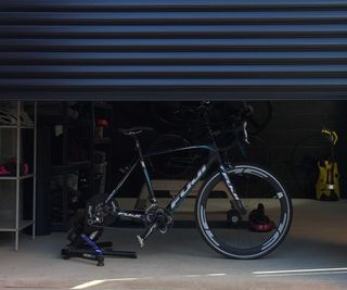 electric black metal garage doors with bike