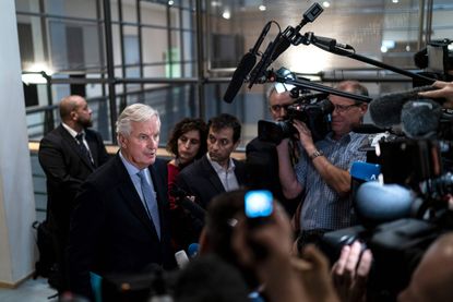 European Union's chief Brexit negotiator Michel Barnier answers journalists questions as he arrives for a meeting at the European Parliament in Brussels on October 2, 2019. (Photo by Kenzo TR