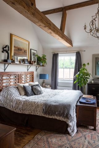 bedroom with beams in an 18th century renovated farmhouse
