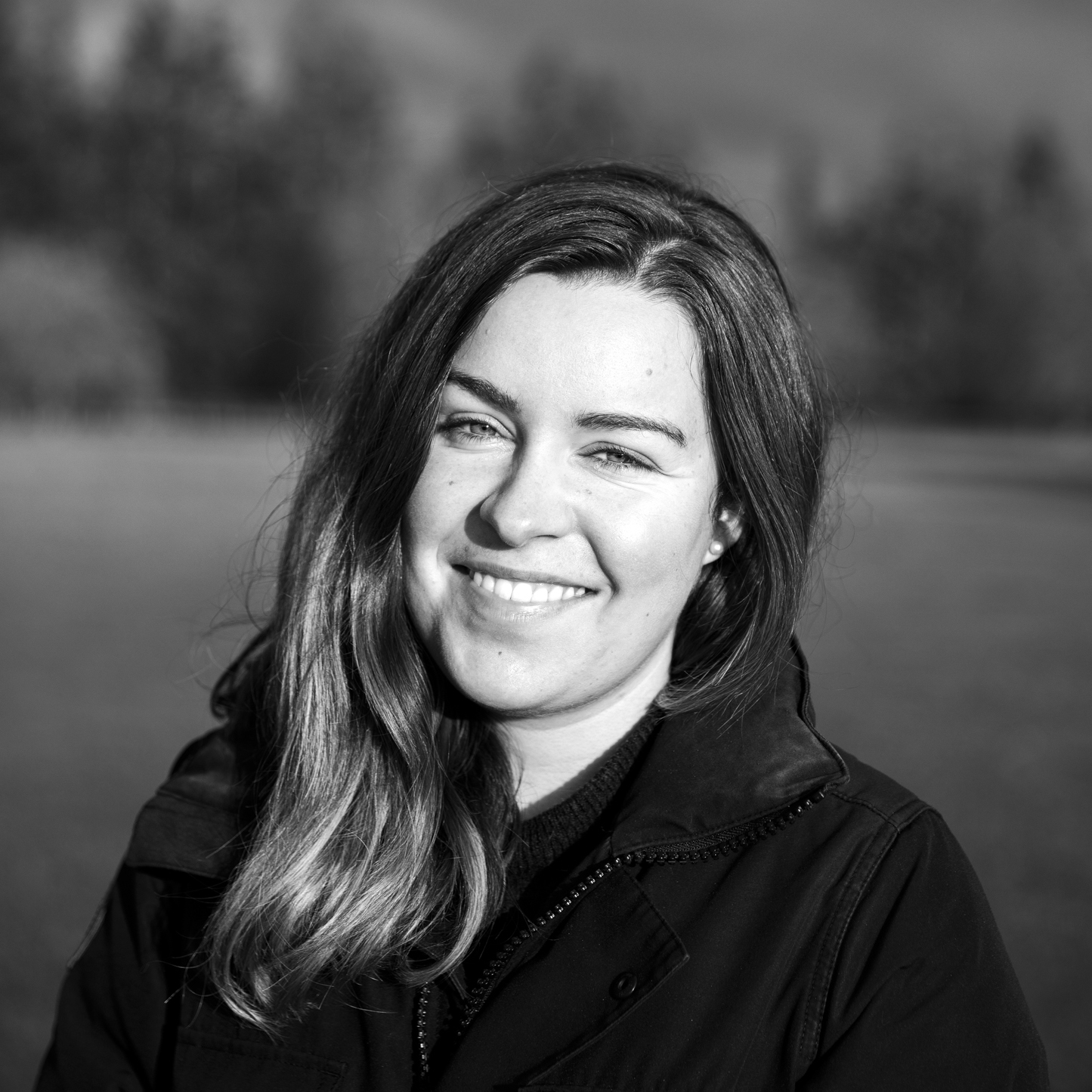 A black and white headshot of contributor Lauren Scott