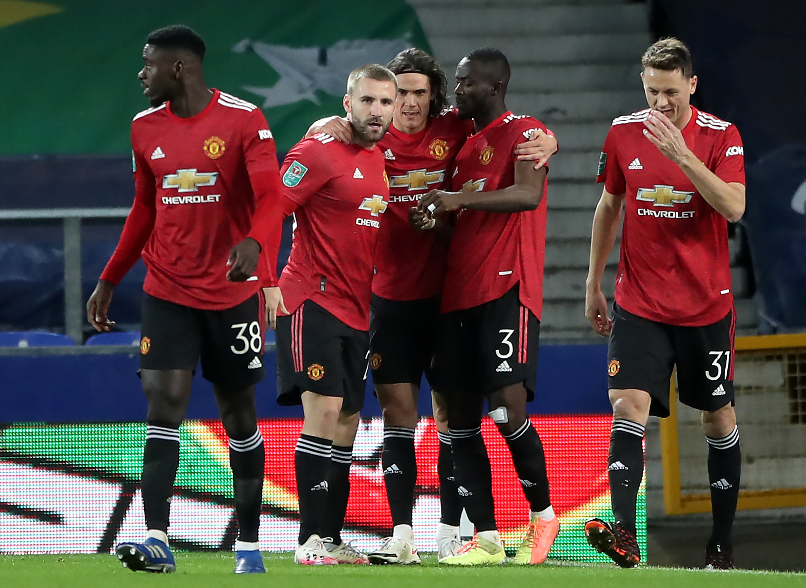 Edinson Cavani (centre) scored with two minutes remaining and Anthony Martial added second in injury time as United beat Everton