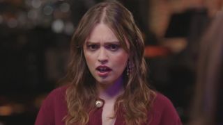 Aimee Lou Wood reacting to the cast all having moustaches. 