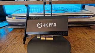 Elgato Game Capture 4K Pro sitting up against a stand