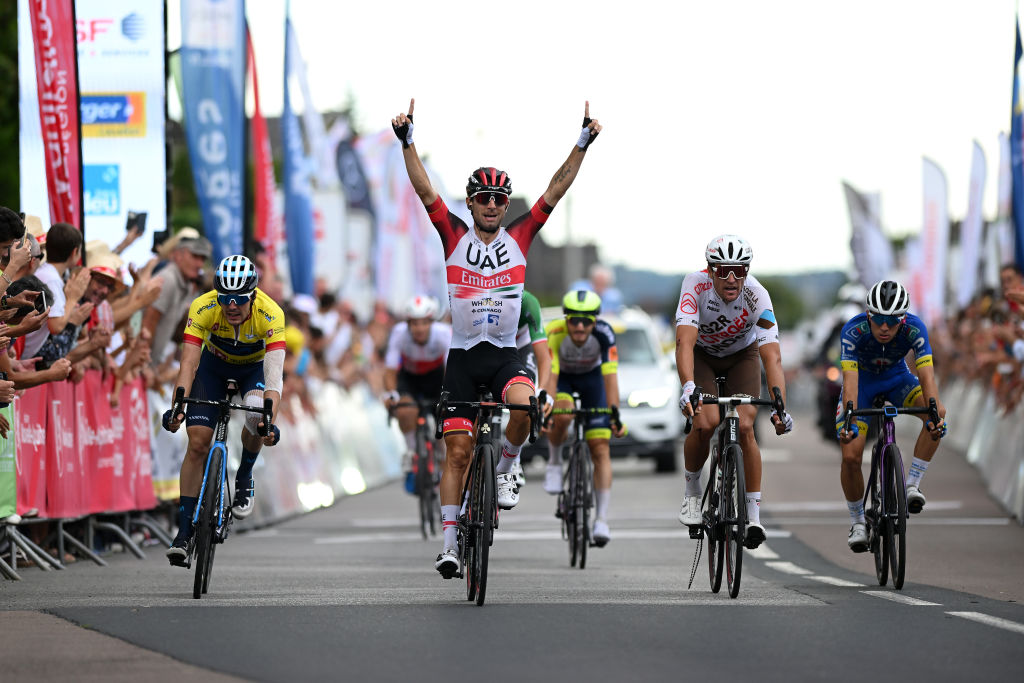 LIMOGES FRANCE AUGUST 18 Diego Ulissi of Italy and UAE Team Emirates celebrates at finish line as stage winner ahead of Alex Aranburu Deba of Spain and Movistar Team Yellow Leader Jersey L and Greg Van Avermaet of Belgium and AG2R Citren Team R during the 55th Tour du Limousin Nouvelle Aquitaine 2022 Stage 3 a 1817km stage from Donzenac to Malemort TDL2022 on August 18 2022 in Limoges France Photo by Dario BelingheriGetty Images