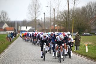 NINOVE BELGIUM MARCH 01 LR Rune Herregodts of Belgium and Antonio Morgado of Portugal and Team UAE Team Emirates lead the peloton during the 80th Omloop Het Nieuwsblad 2025 Mens Elite a 197km one day race from Ghent to Ninove UCIWWT on March 01 2025 in Ninove Belgium Photo by Luc ClaessenGetty Images