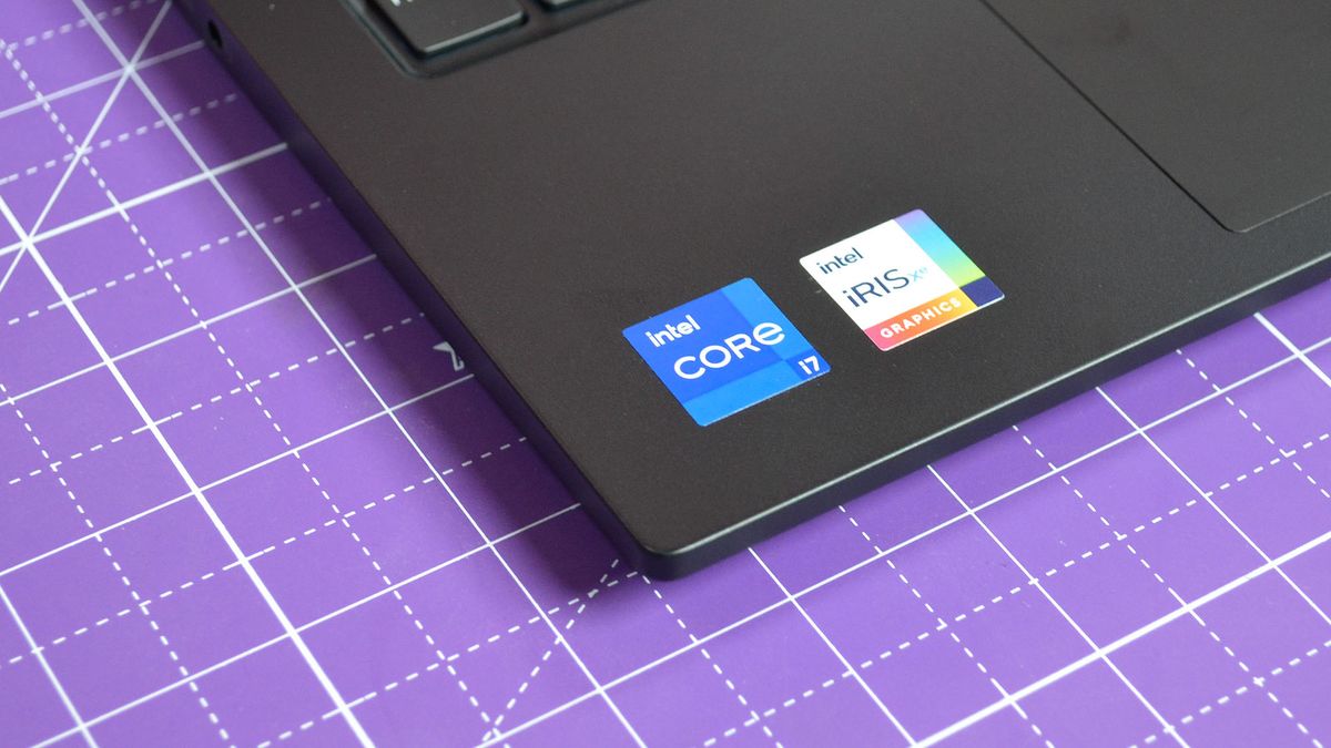 An Lenovo ThinkPad E14 Gen 5 on a purple deskmat