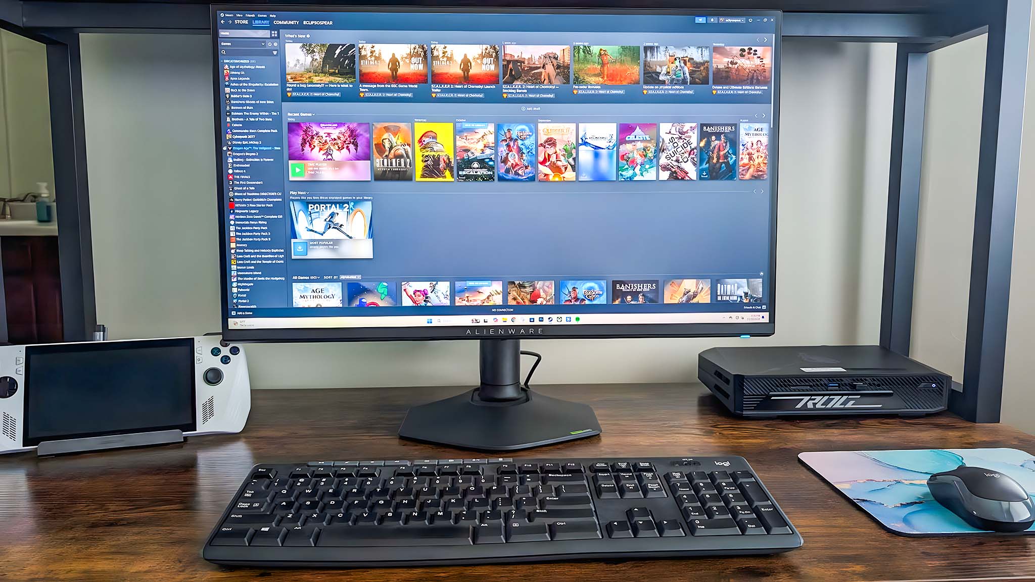 Alienware AW2725QF Gaming Monitor on desk and displaying Steam library.