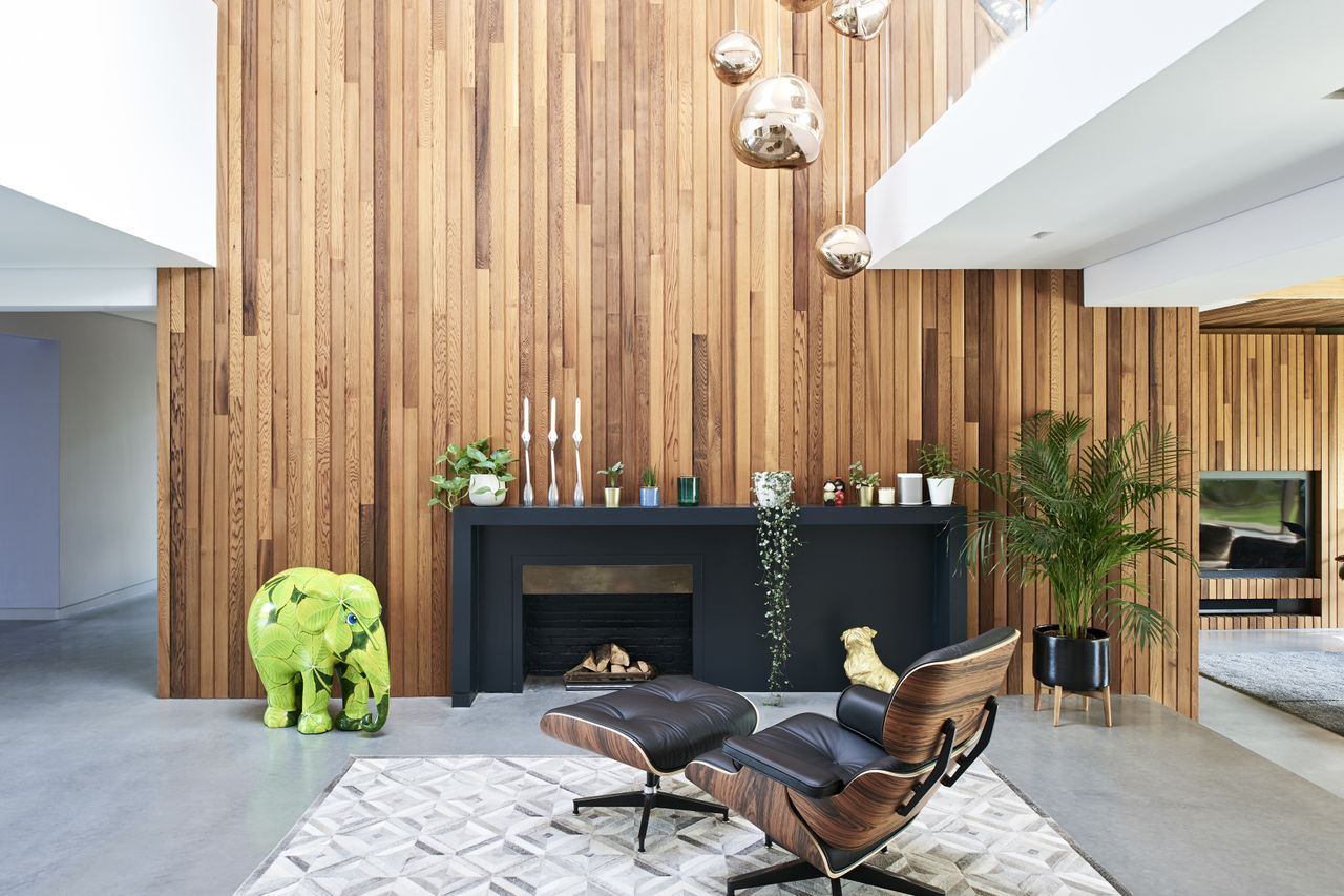 fireplace in remodelled interior with timber cladding