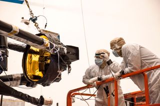 Engineers perform inspections of the James Webb Space Telescope's secondary mirror following a recently successful deployment test at Northrop Grumman in Redondo Beach, California.