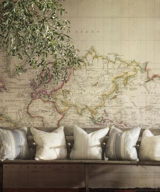 Large map mural behind a seat in a living room