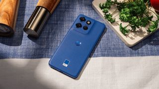 Motorola Edge 50 Neo in blue on a tablecloth