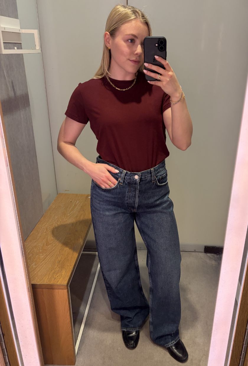 woman wears blue jeans