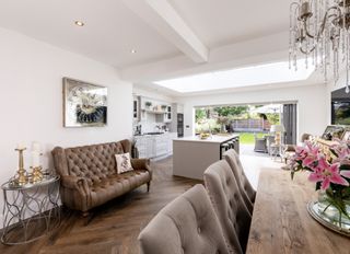 An open plan extension with a living room and kitchen space.