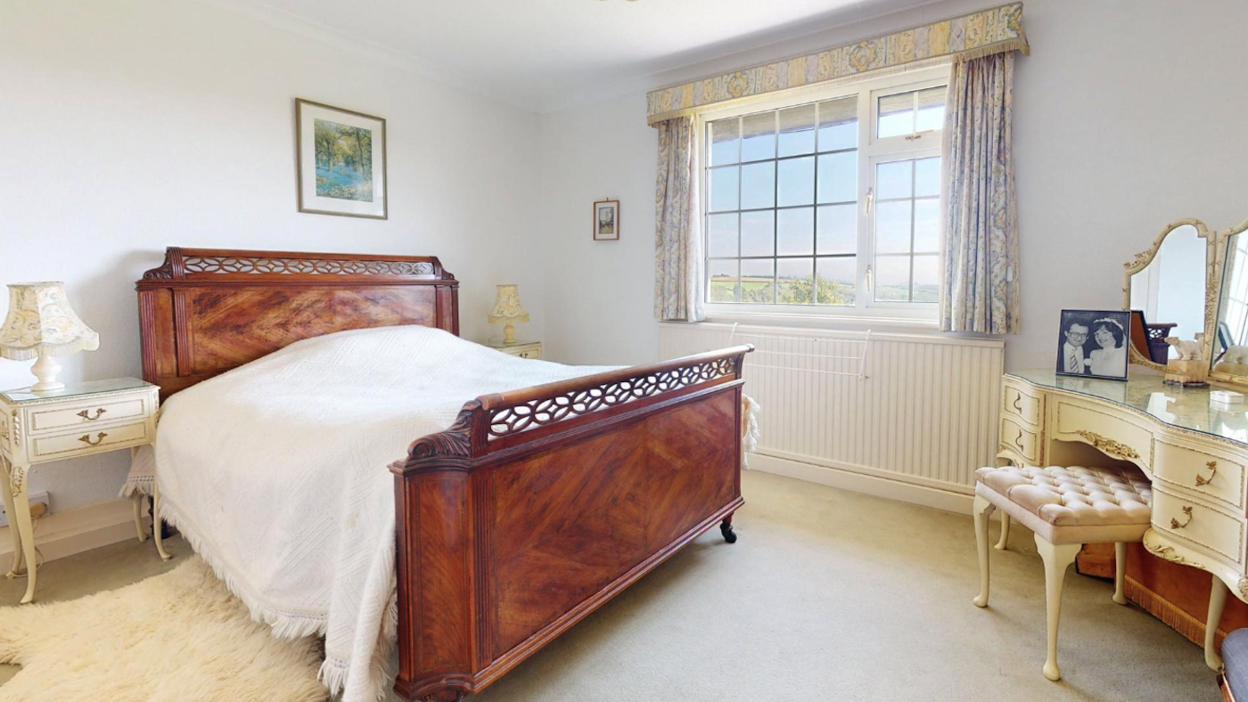 A bedroom with a sunny view
