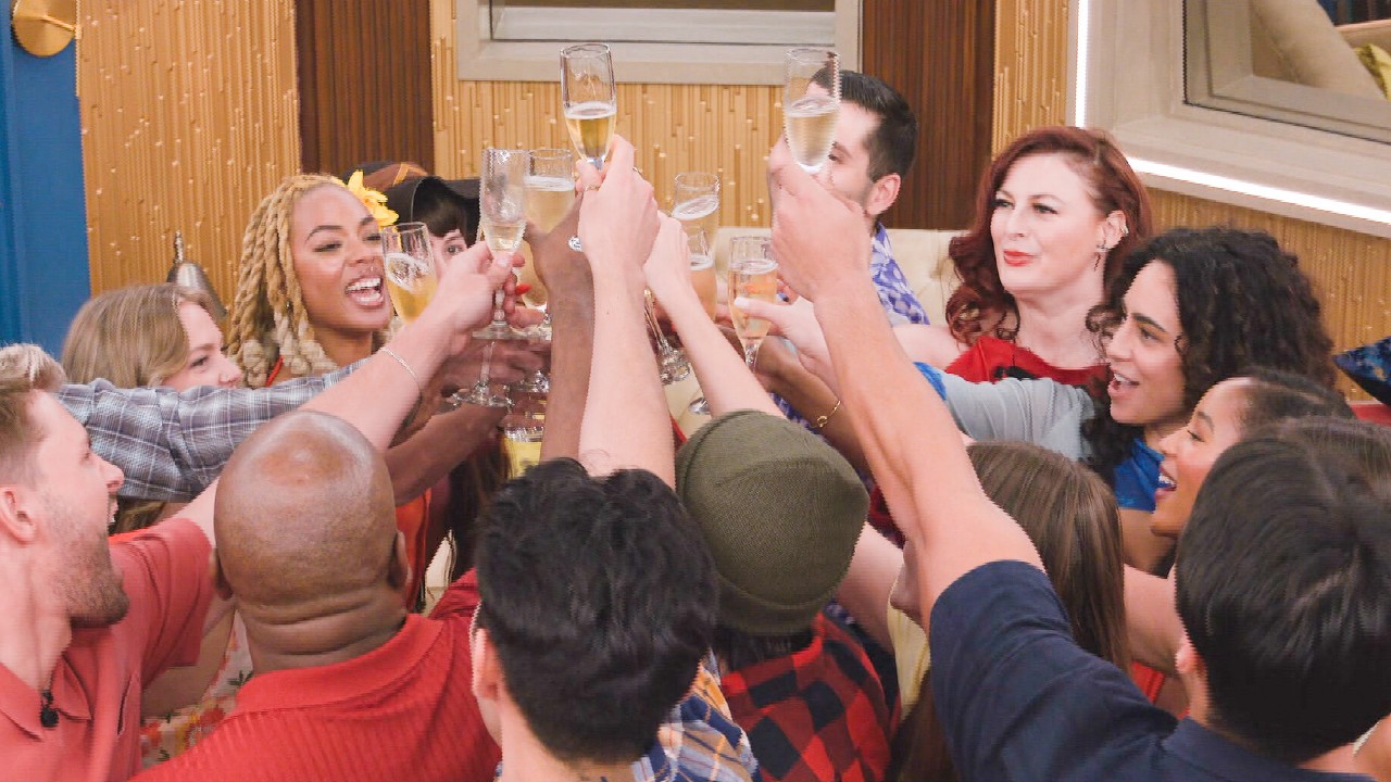 The houseguests toasting each other after moving in.