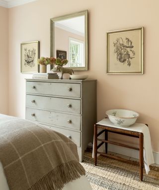 vintage bedroom with antique furniture and pale pink walls