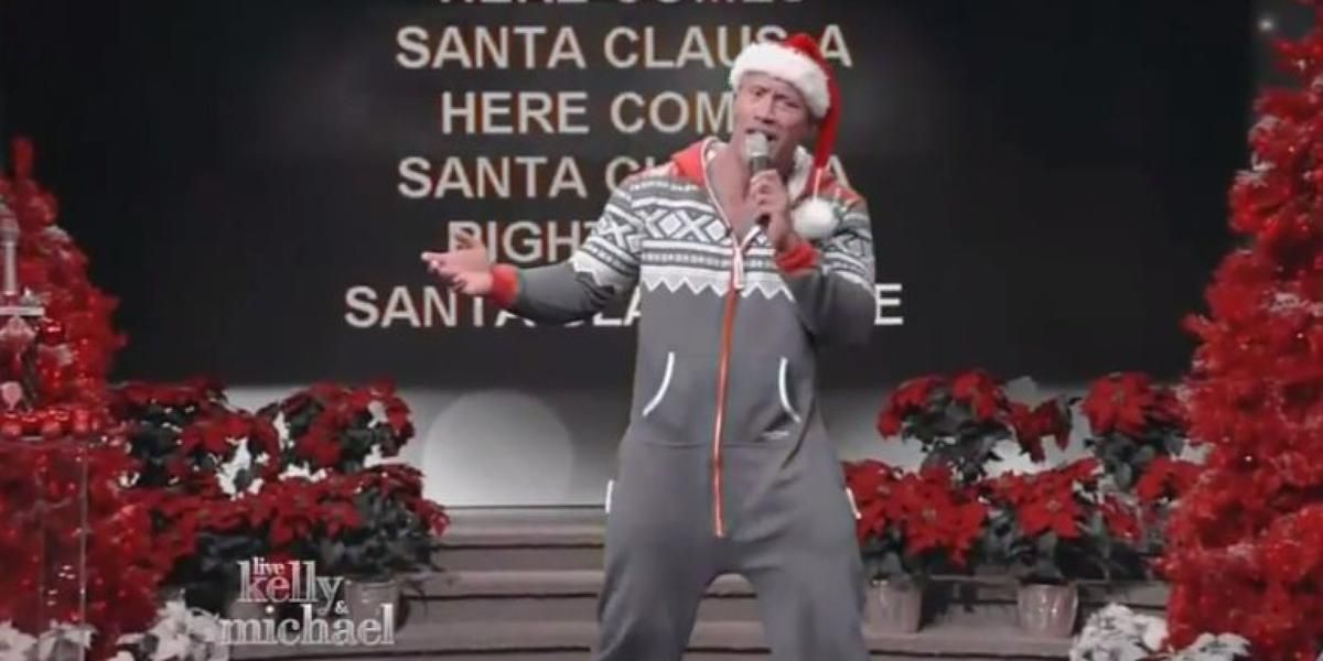 Watch The Rock karaoke &amp;#039;Here Comes Santa Claus&amp;#039; in a onesie