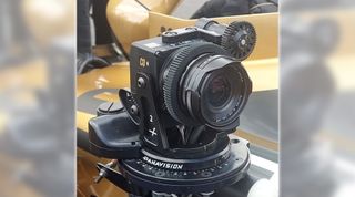 Image of a small cinema camera mounted to an F1 car