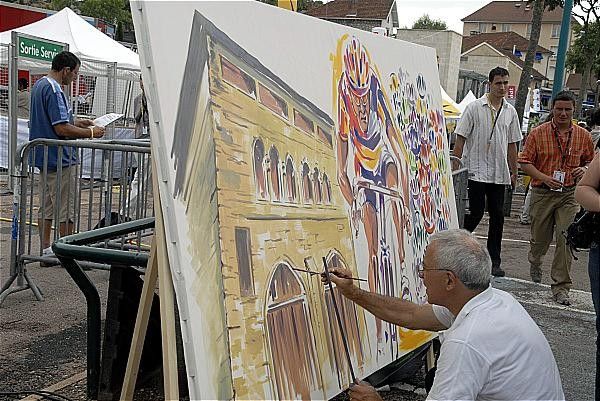 A local painter shows off his work.
