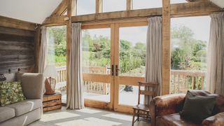 oak frame summer house with arm chairs