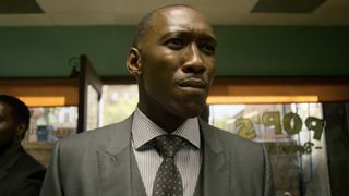 Cornell Stokes (Maheshala Ali) enters the barbershop on Luke Cage.