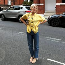 Lucy wearing sandals and stovepipe jeans