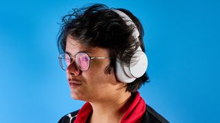 The AKG N9 Hybrid headphones photographed in front of a blue background.