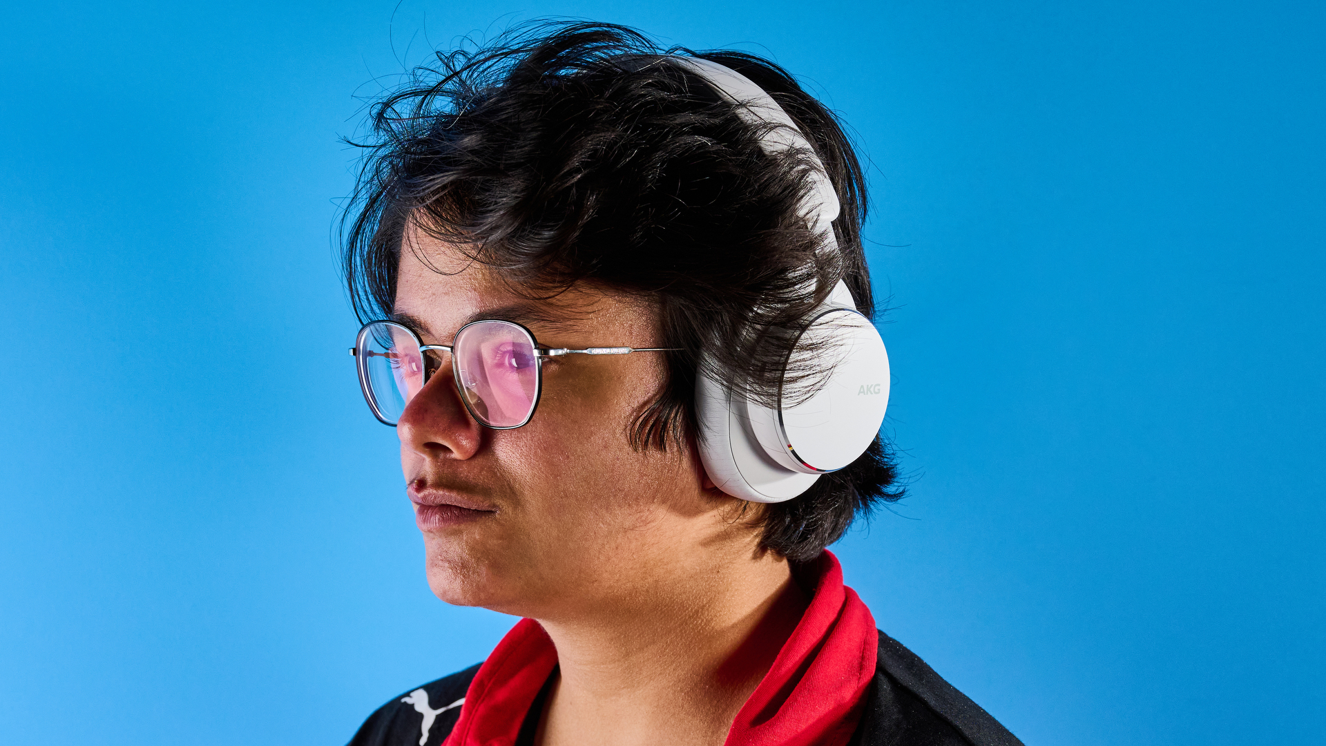 The AKG N9 Hybrid headphones photographed in front of a blue background.