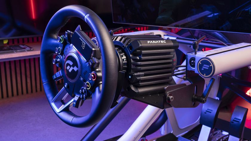 The Fanatec Gran Turismo DD Pro wheel and wheelbase attached to a cockpit chair