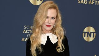 nicole kidman with long curls and a side parting
