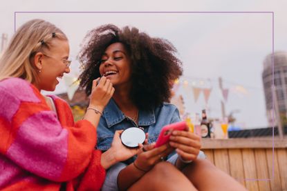 Two teens playing on phone