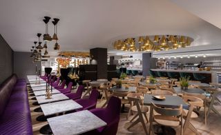 The dining room in the Tom Dixon sandwich shop has awesome purple and wooden chairs as well as a gorgeous ceiling