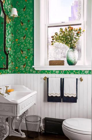 Small bathroom with green wallpaper