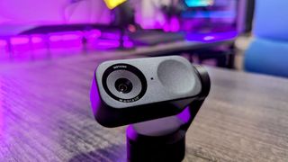 A close-up of the Insta360 Link 2 webcam's sensor and LED indicators.