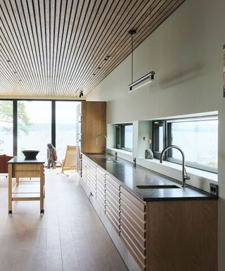 Galley kitchen with wooden slats and flooring