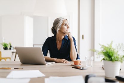 Businesswoman working on laptop in office