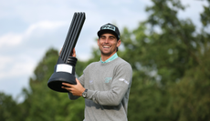 Joaquin Niemann holds a LIV Golf trophy