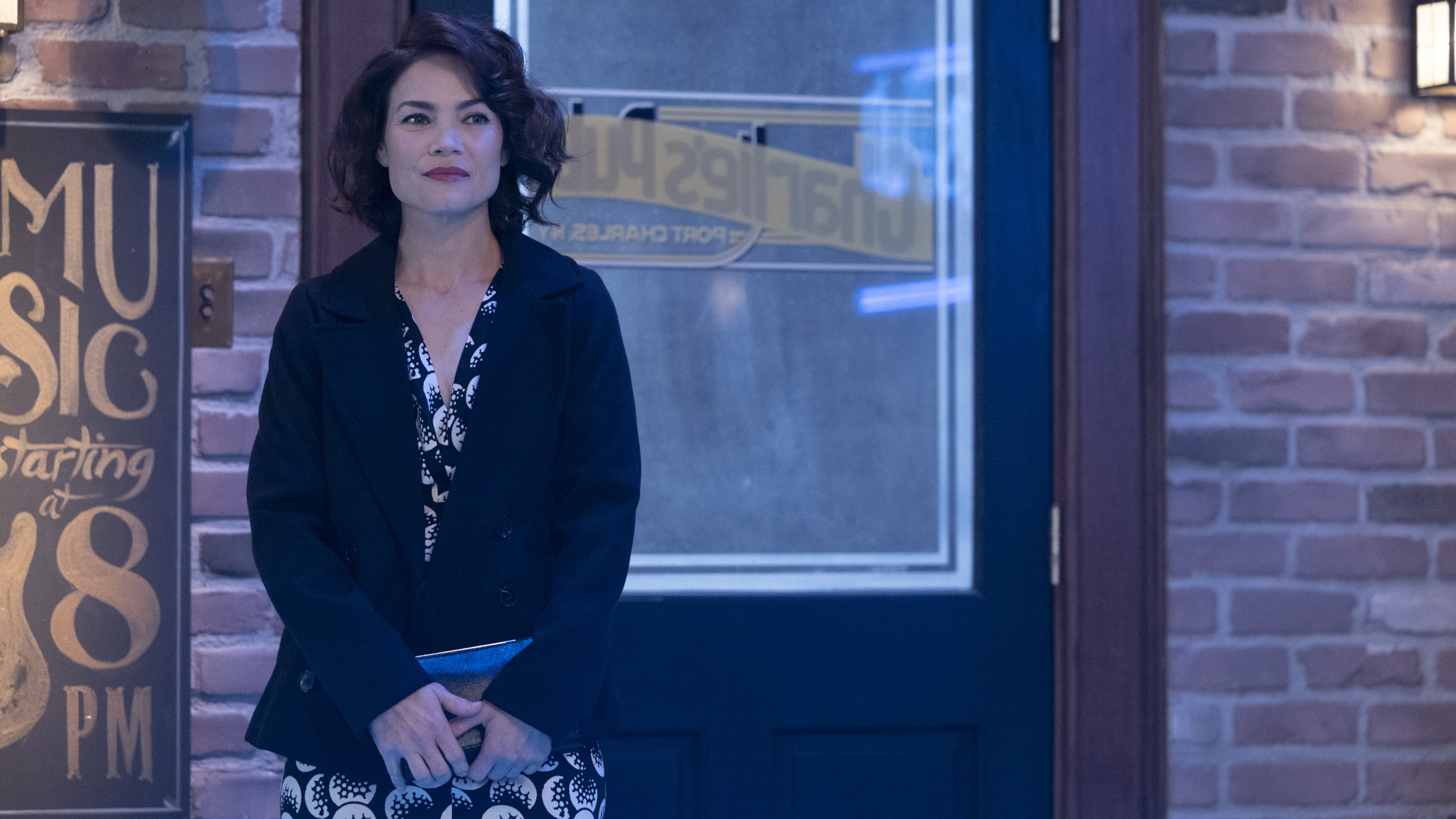 Rebecca Herbst as Elizabeth standing outside of a bar in General Hospital 