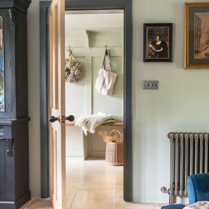 wooden internal door from the living room to the hallway. The doorframe has been painted in a contrasting colour