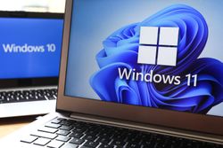 Two laptops showing Windows 11 and Windows 10