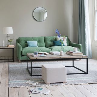 living room with sofa and table lamp