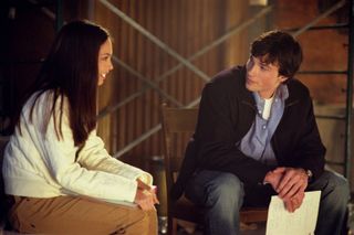 Greg Beeman Tom Welling and Kristin Kreuk speaking to each other in a still from smallville