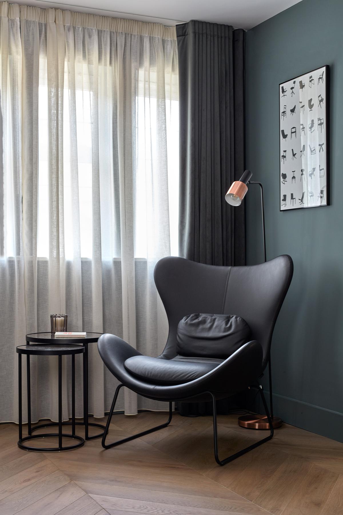 A living room with double curtain rod