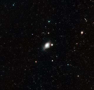 This picture shows the sky around the pair of galaxies NGC 1316 and 1317. It was created from images forming part of the Digitized Sky Survey 2.